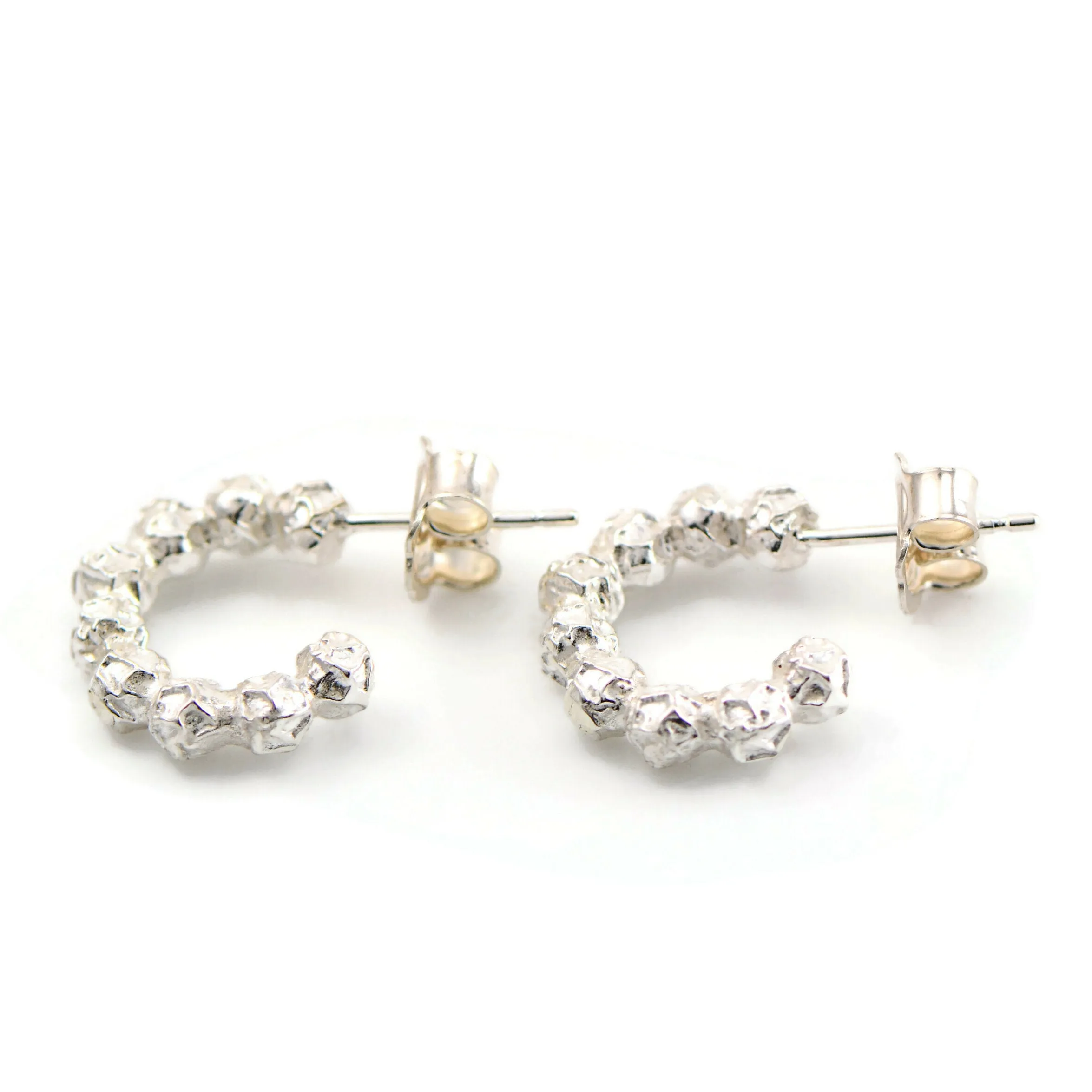 A small silver peppercorns hoops earrings