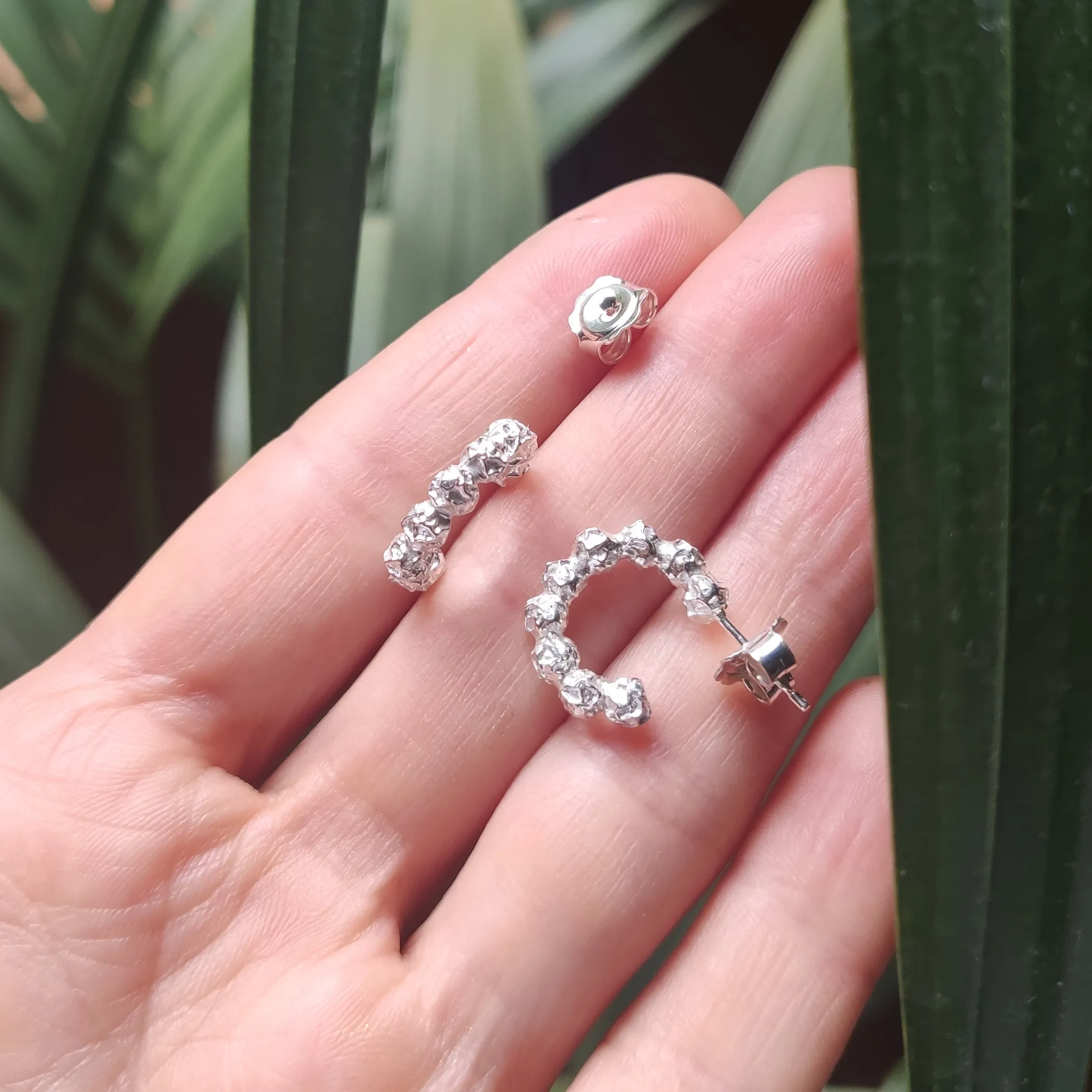 A small silver peppercorns hoops earrings